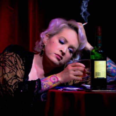 A woman smoking and drinking