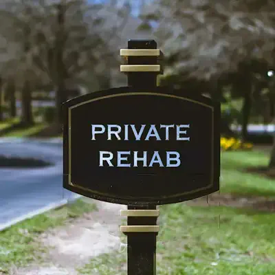Sign saying private drug rehab.