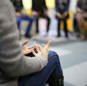 Support in addiction recovery in group meetings.