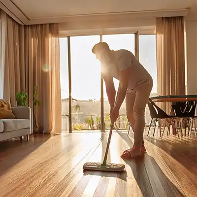 A man mopping a floor