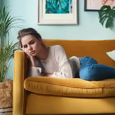 A woman looking depressed, a sign of relapse