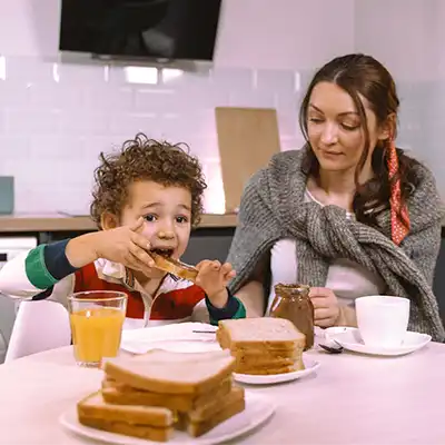 A child eating breakfast.