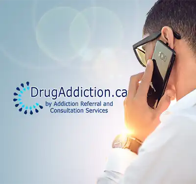 Man on cellphone for addiction treatment.